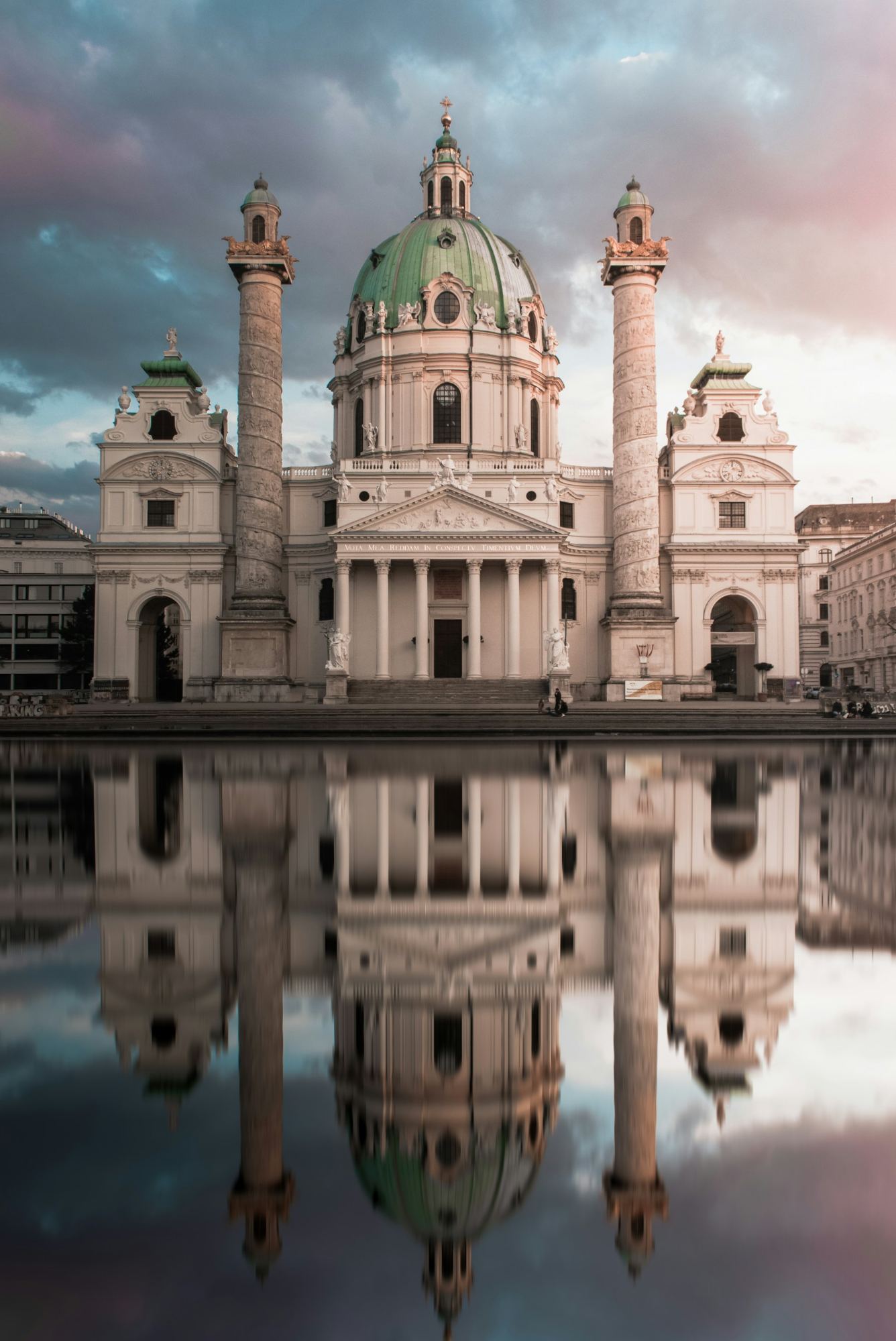 Karlskirche in Vienna reflected in the still pool in front of it